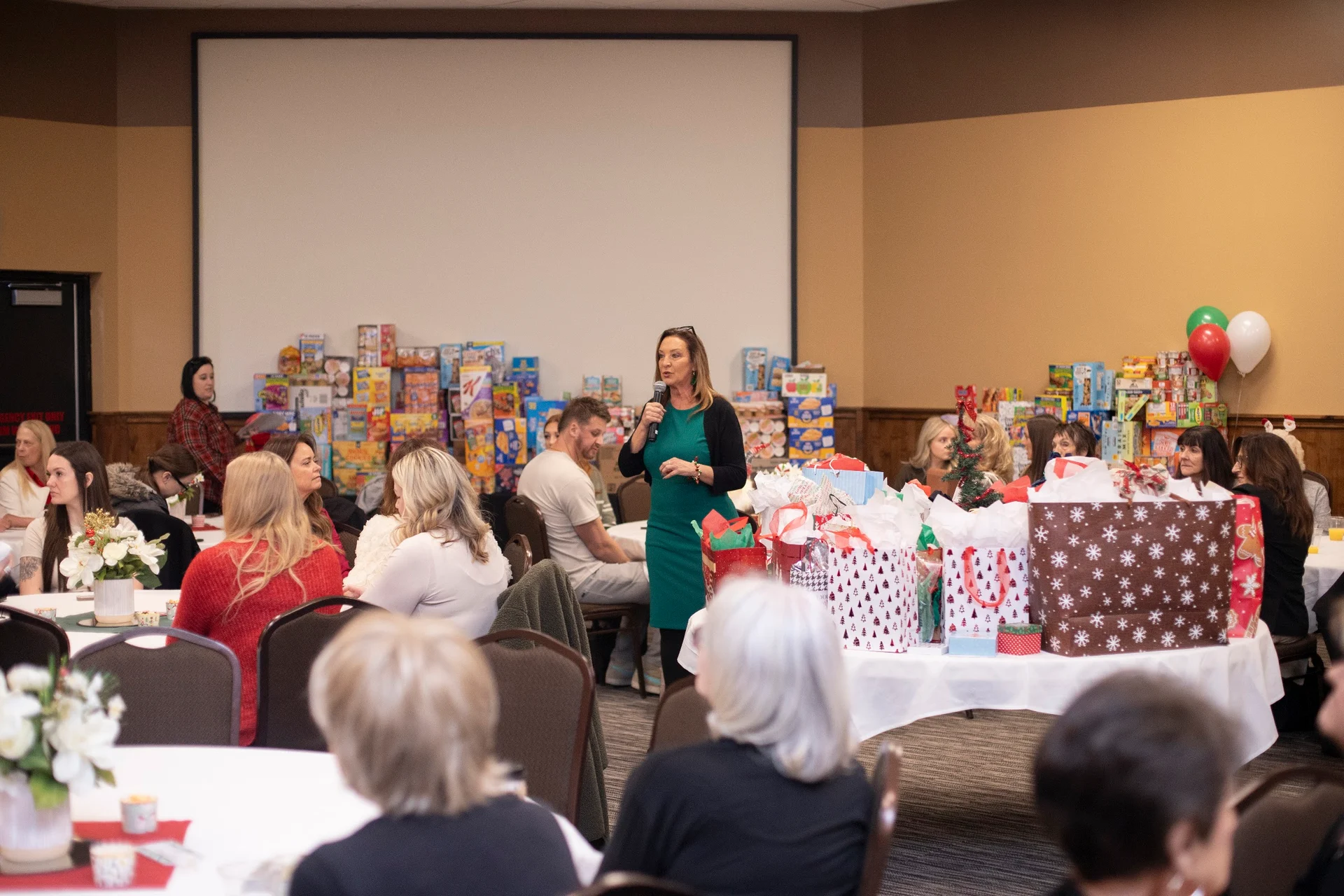 Guests gathered around holiday tables at the 2025 Mamma Bears event