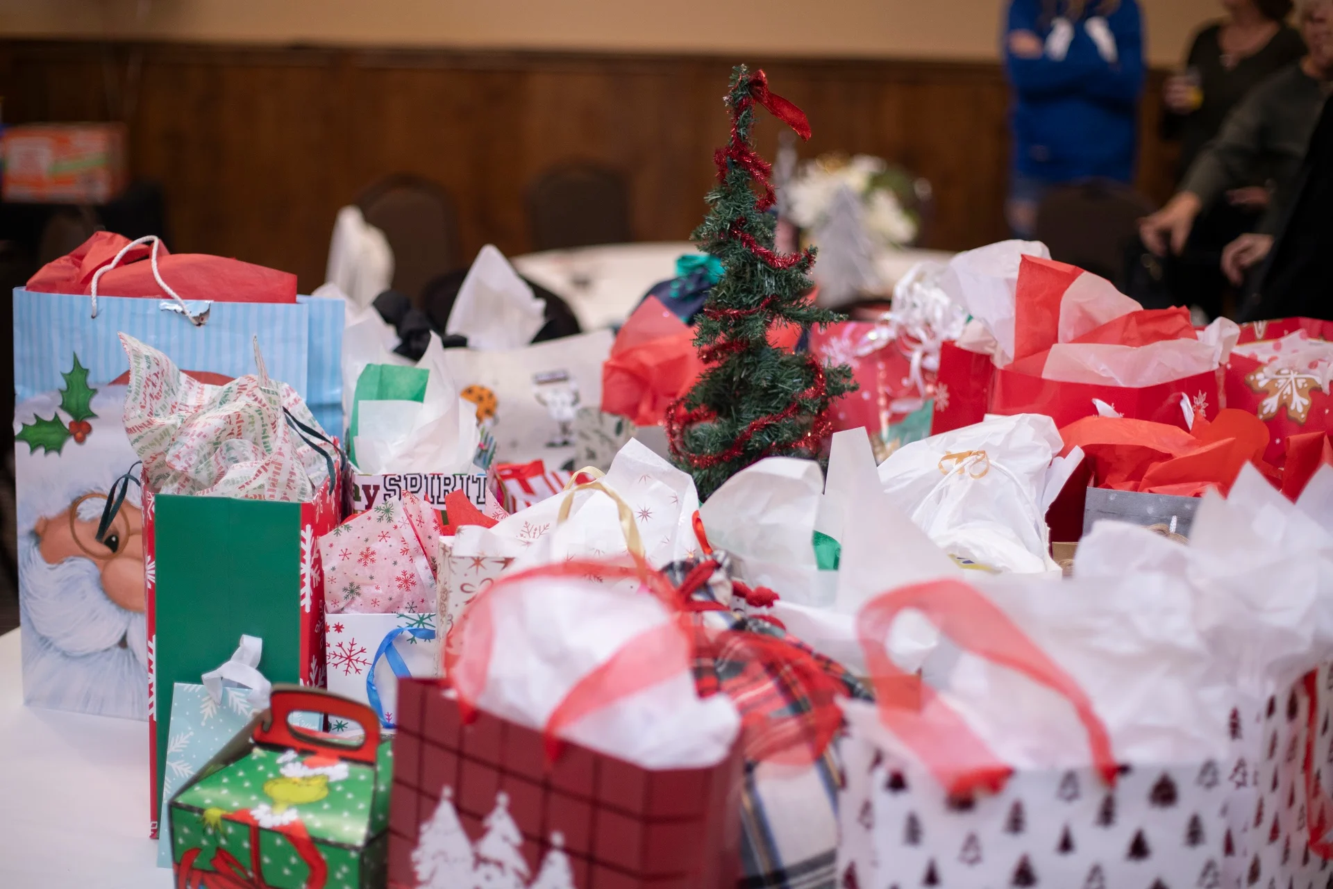 Colorful wrapped gifts collected on a table at the 2025 event